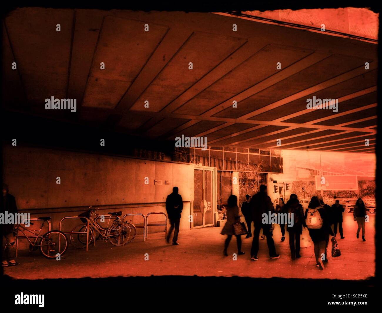 Walking underneath Wood Lane railway bridge, White City, London Borough