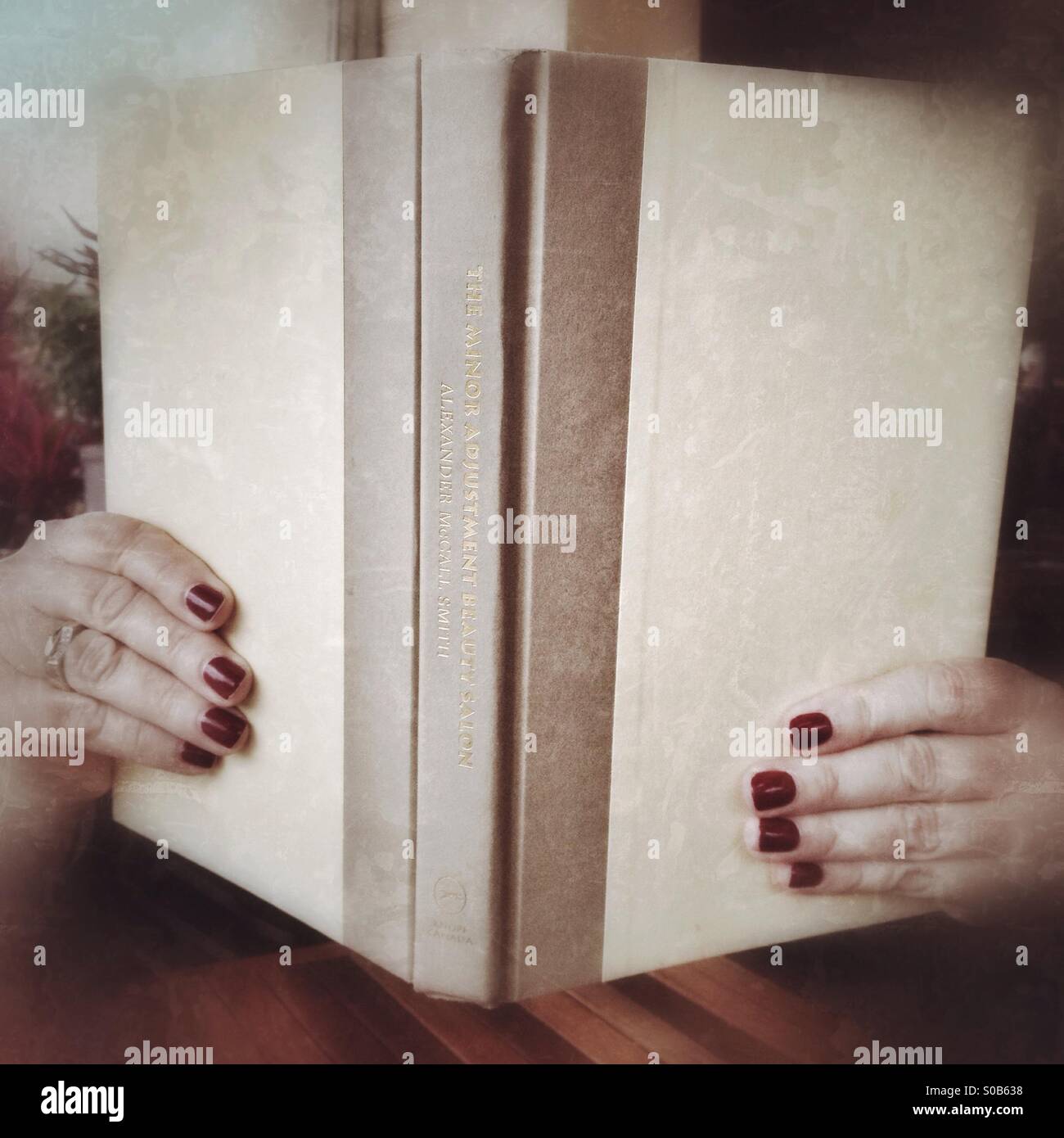 Woman reading novel - Smartphone Captured Stock Image