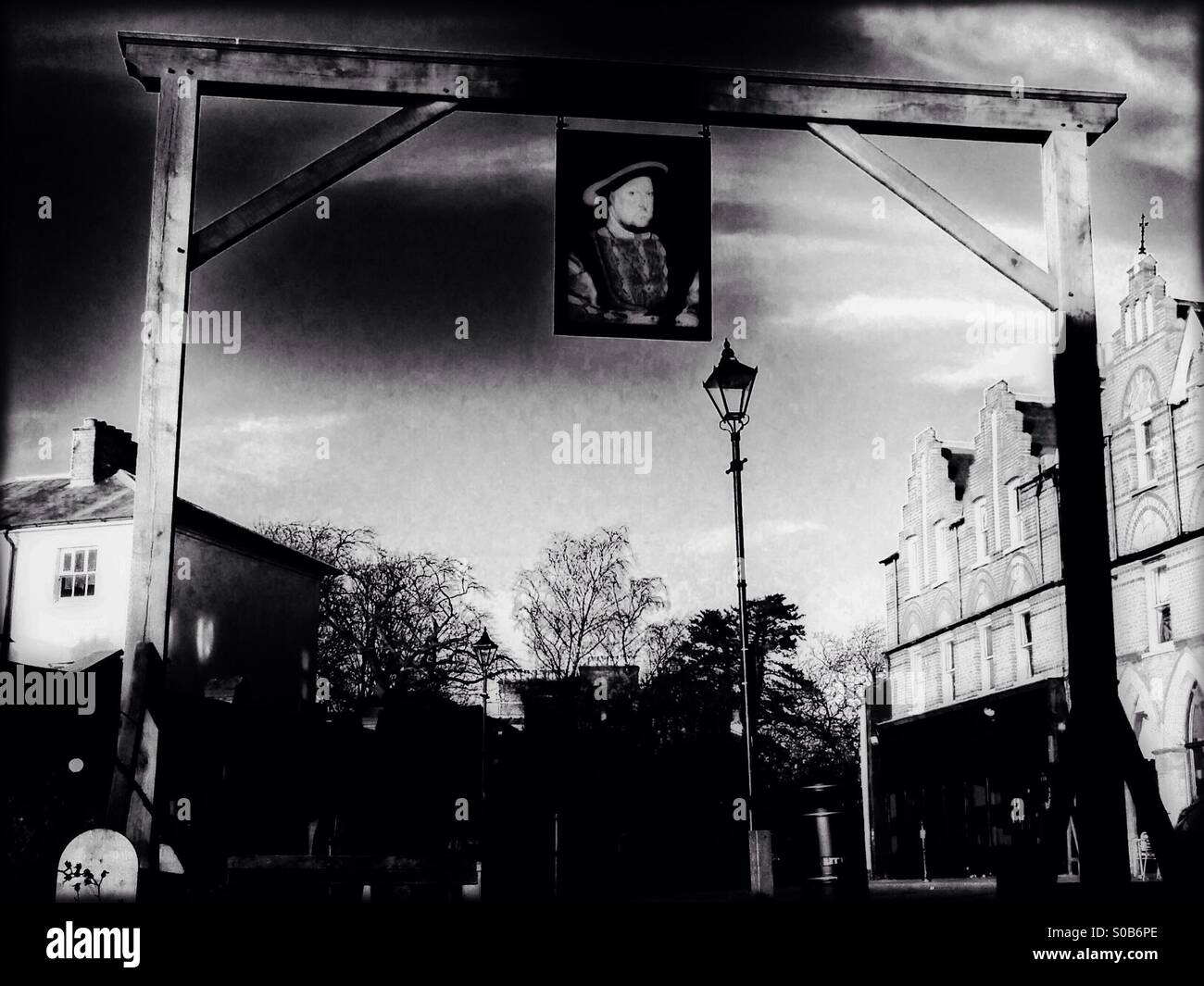 Replica gantry showing hanging portrait of King Henry VIII, Harrow-on-the-hill, North West London, England, United Kingdom, Europe Stock Photo