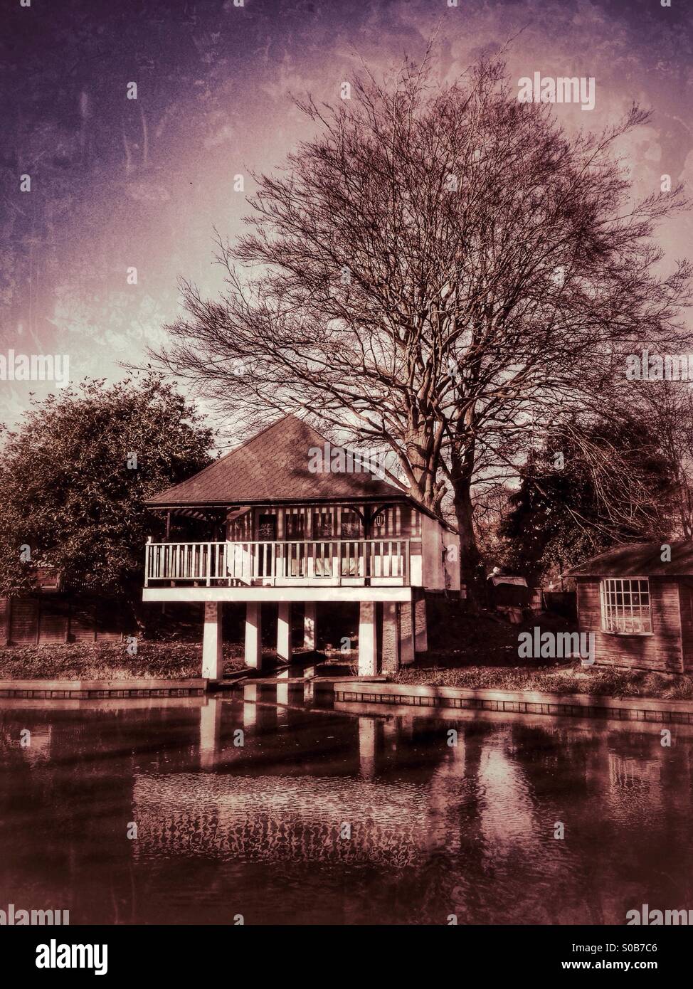 Chalet on stilts. River Wey, Guildford, Surrey, England. Stock Photo