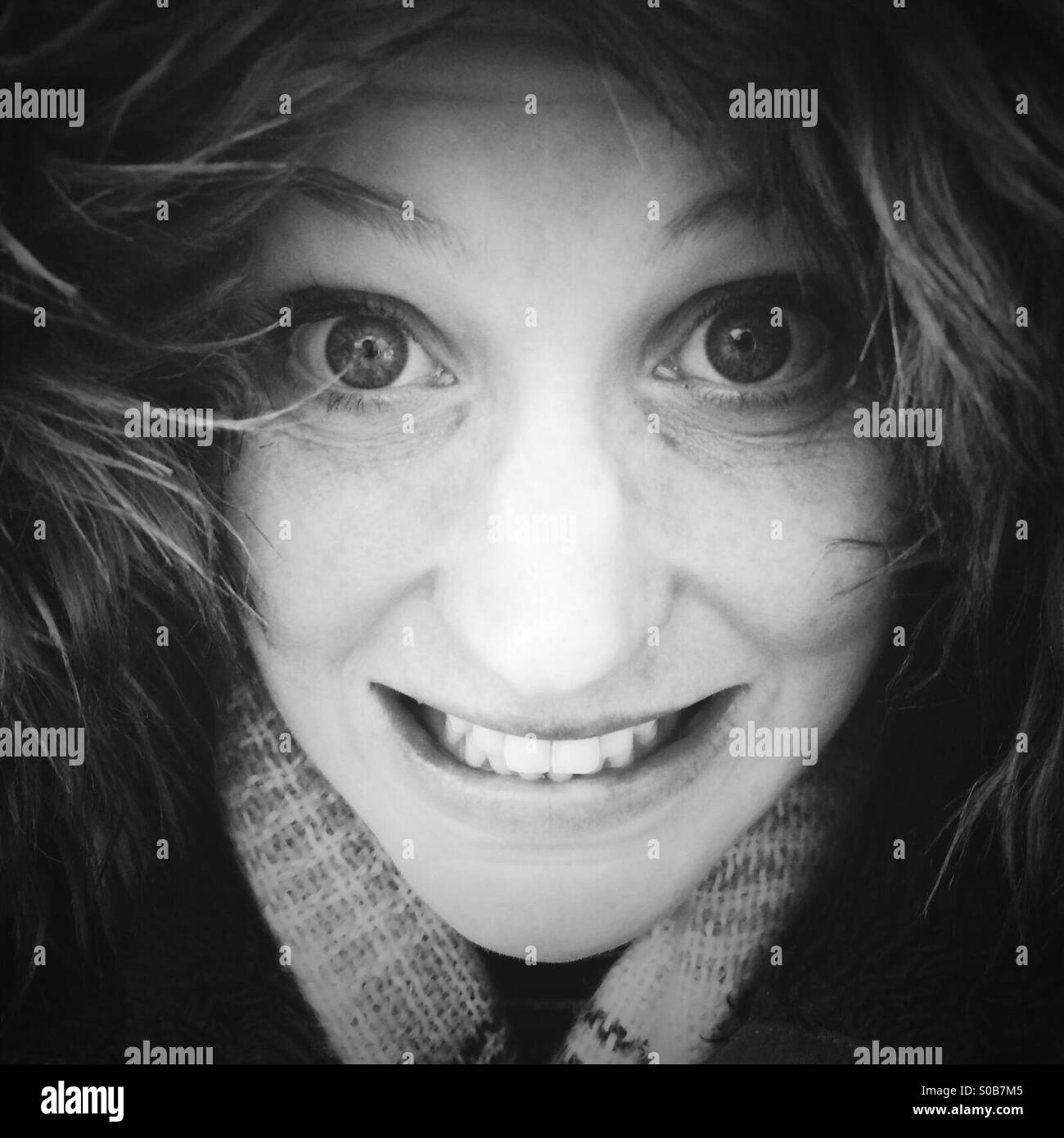 Smiling girl in black and white - Smartphone Captured Stock Image