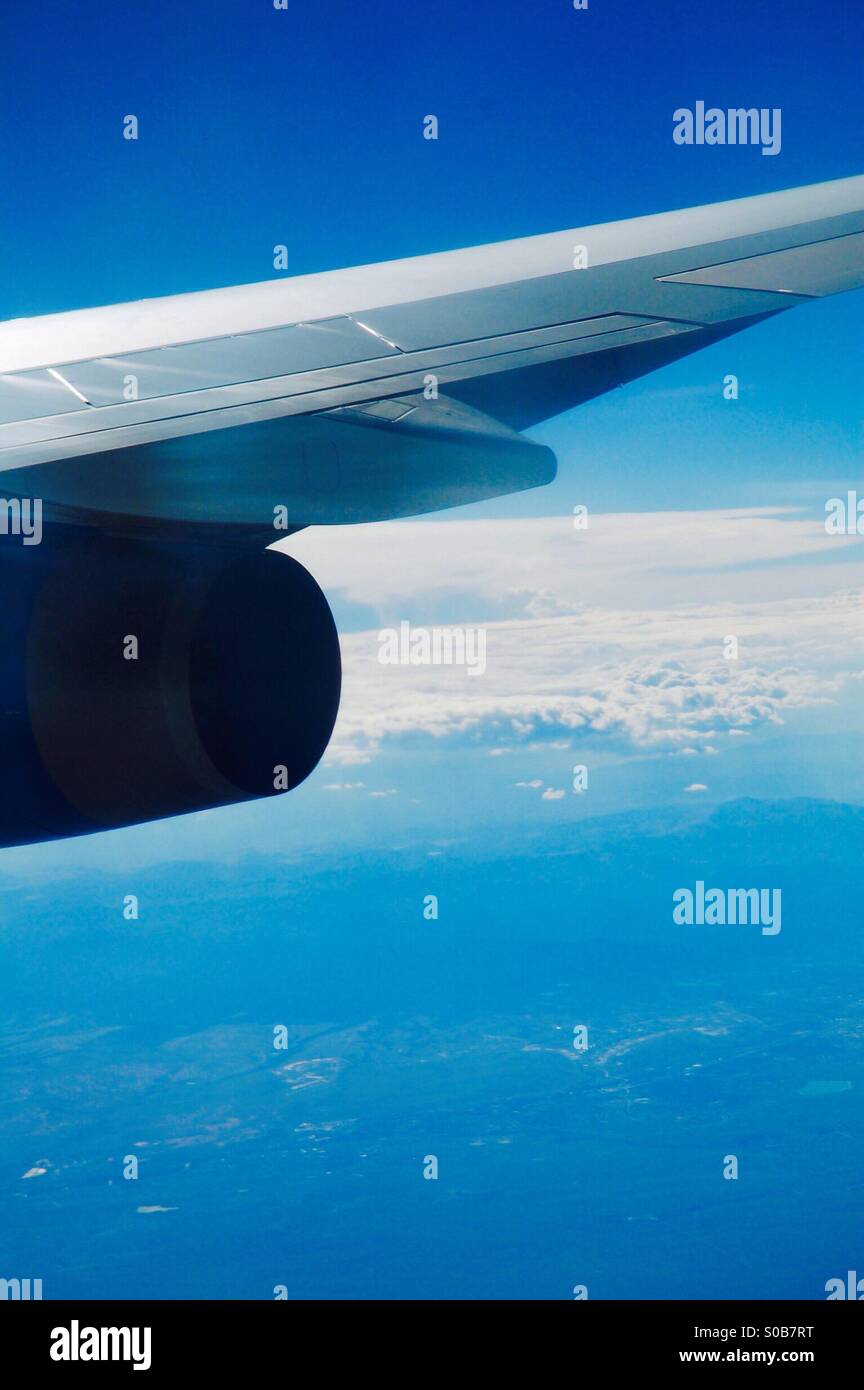 Jet engine and wing out of the window Stock Photo - Alamy