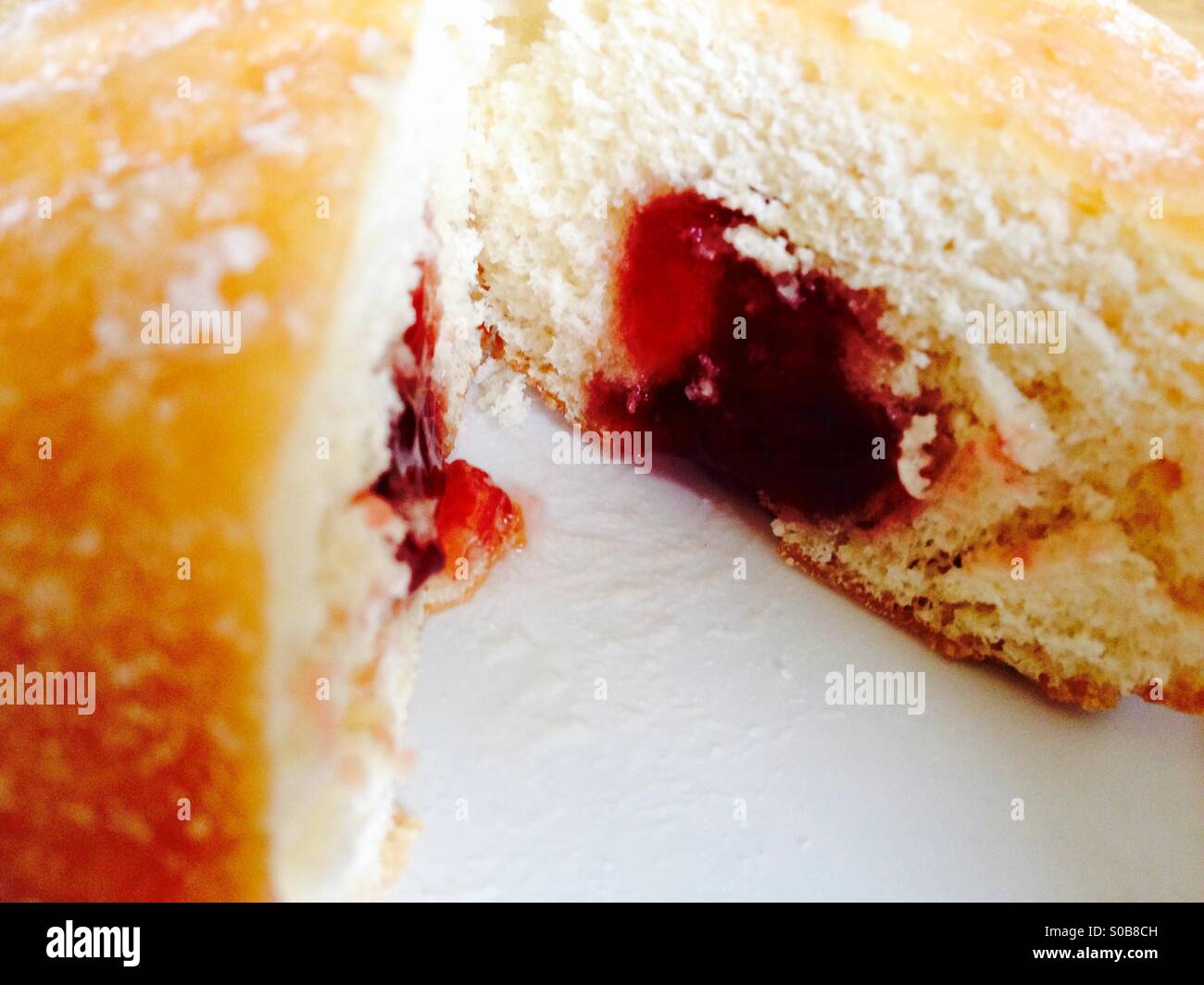 Jam filled doughnut on a white background - Smartphone Captured Stock Image