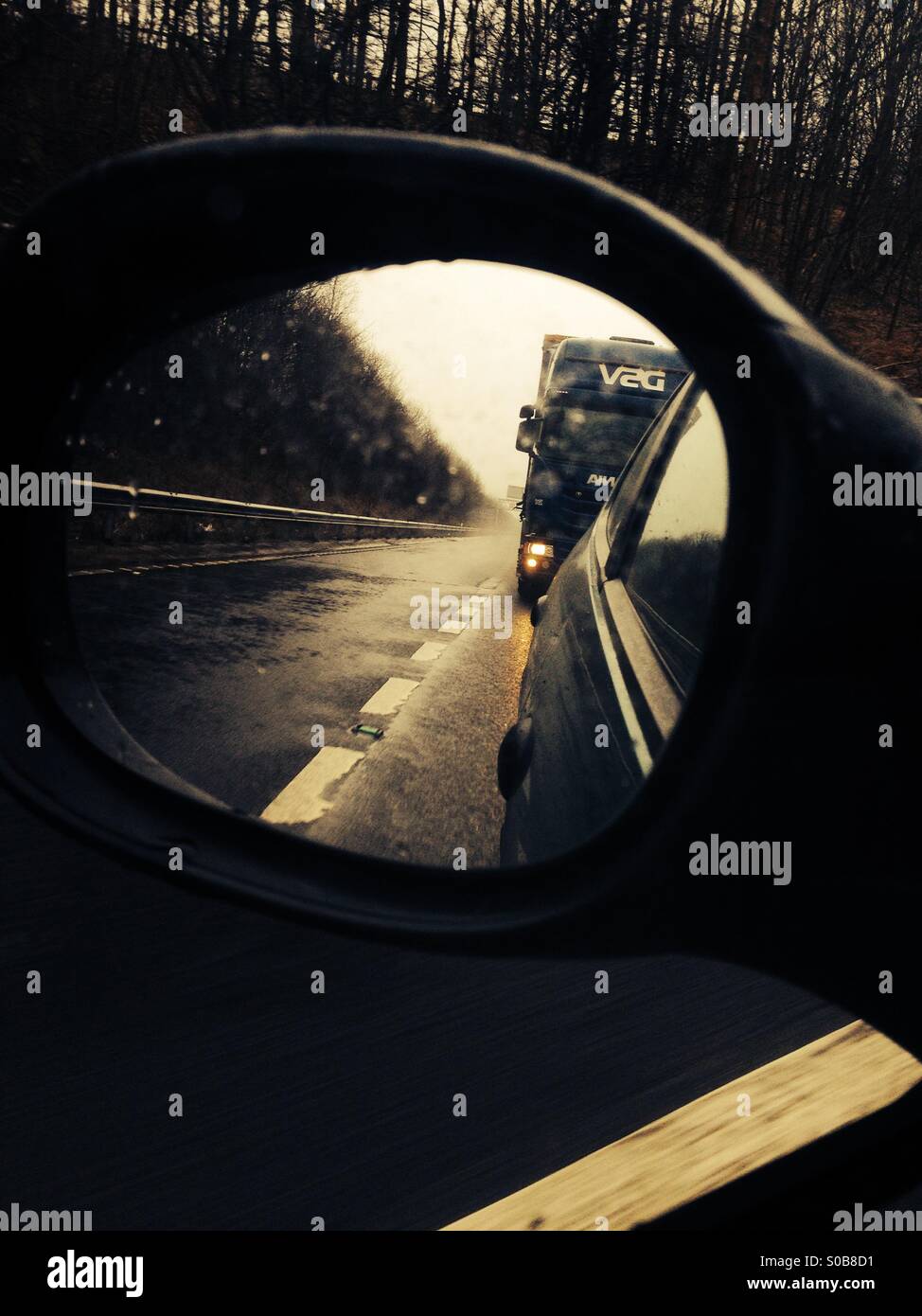 Hgv reflected in a cars mirror on the motorway - Smartphone Captured Stock Image