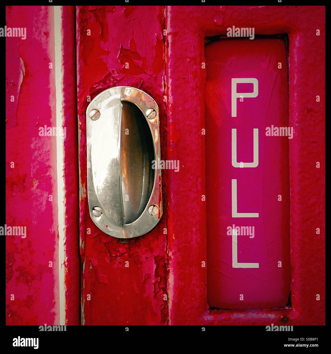 Handle on red door - Smartphone Captured Stock Image