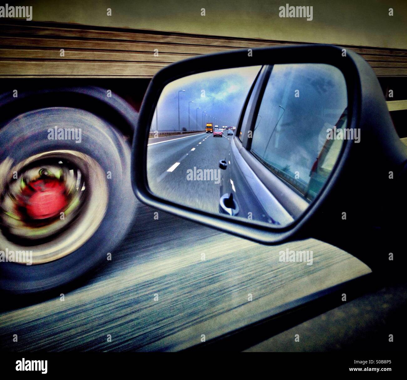 View in rear view mirror as overtaking lorry on M62 - Smartphone Captured Stock Image