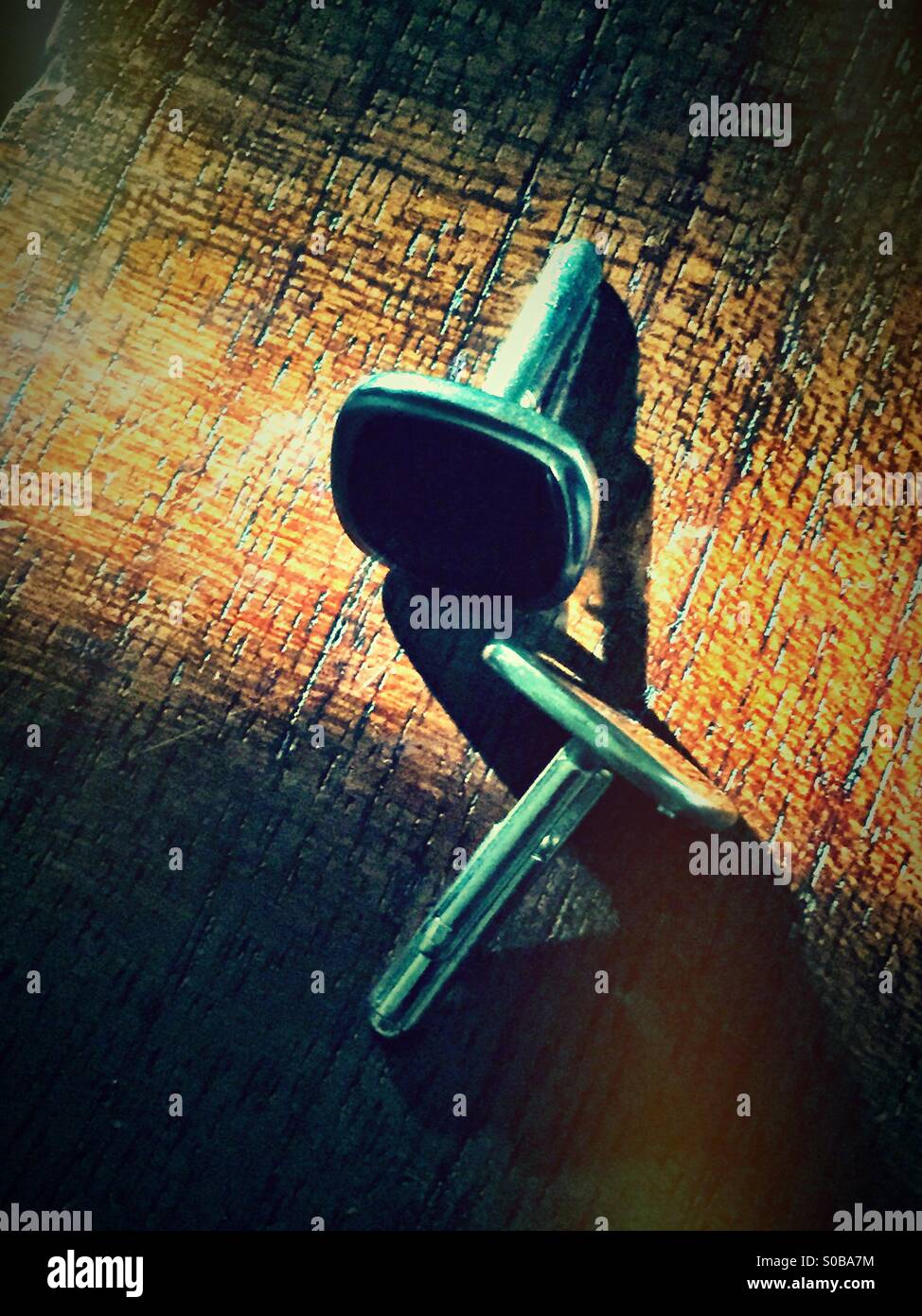 Cuff-links on wood - Smartphone Captured Stock Image