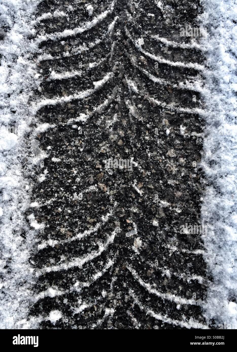 Tyre tracks in the snow. Stock Photo