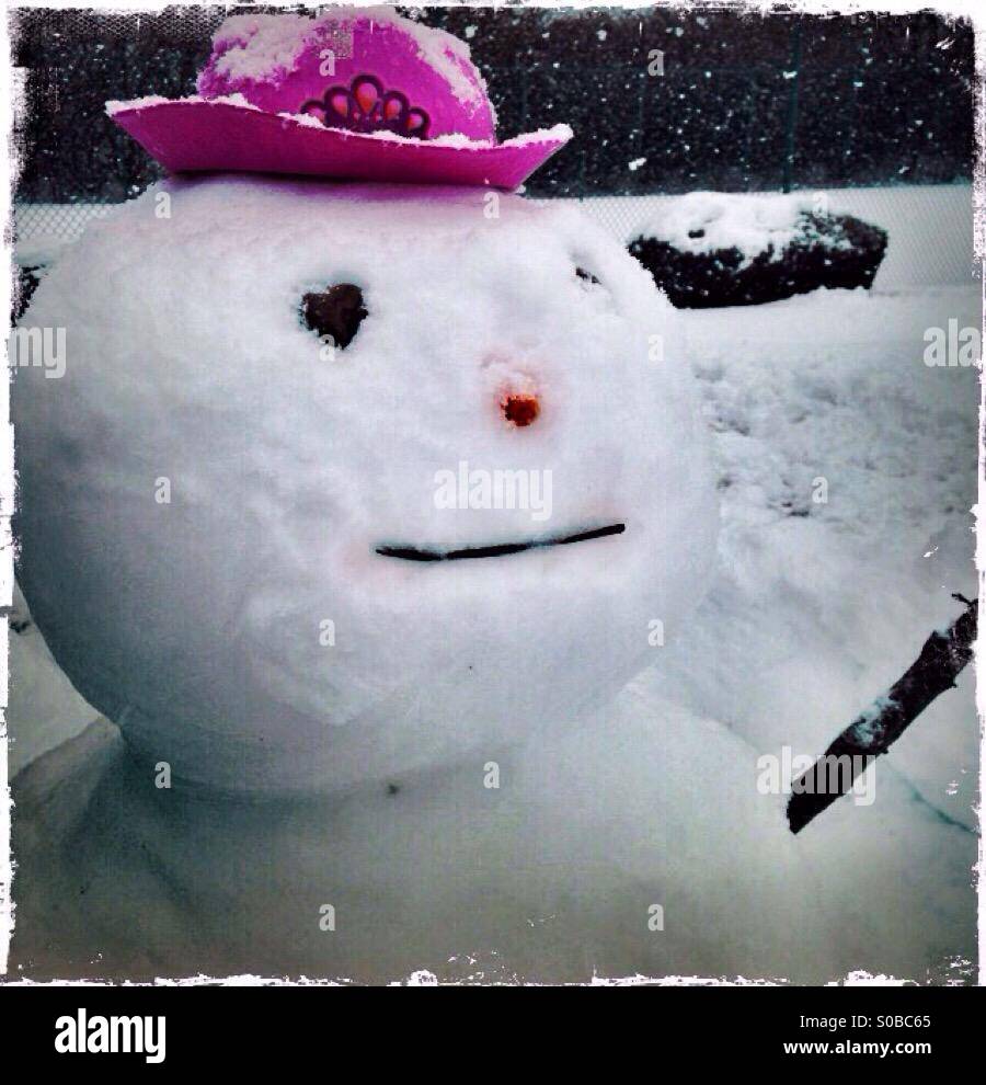 A snowman with a pink hat. - Smartphone Captured Stock Image