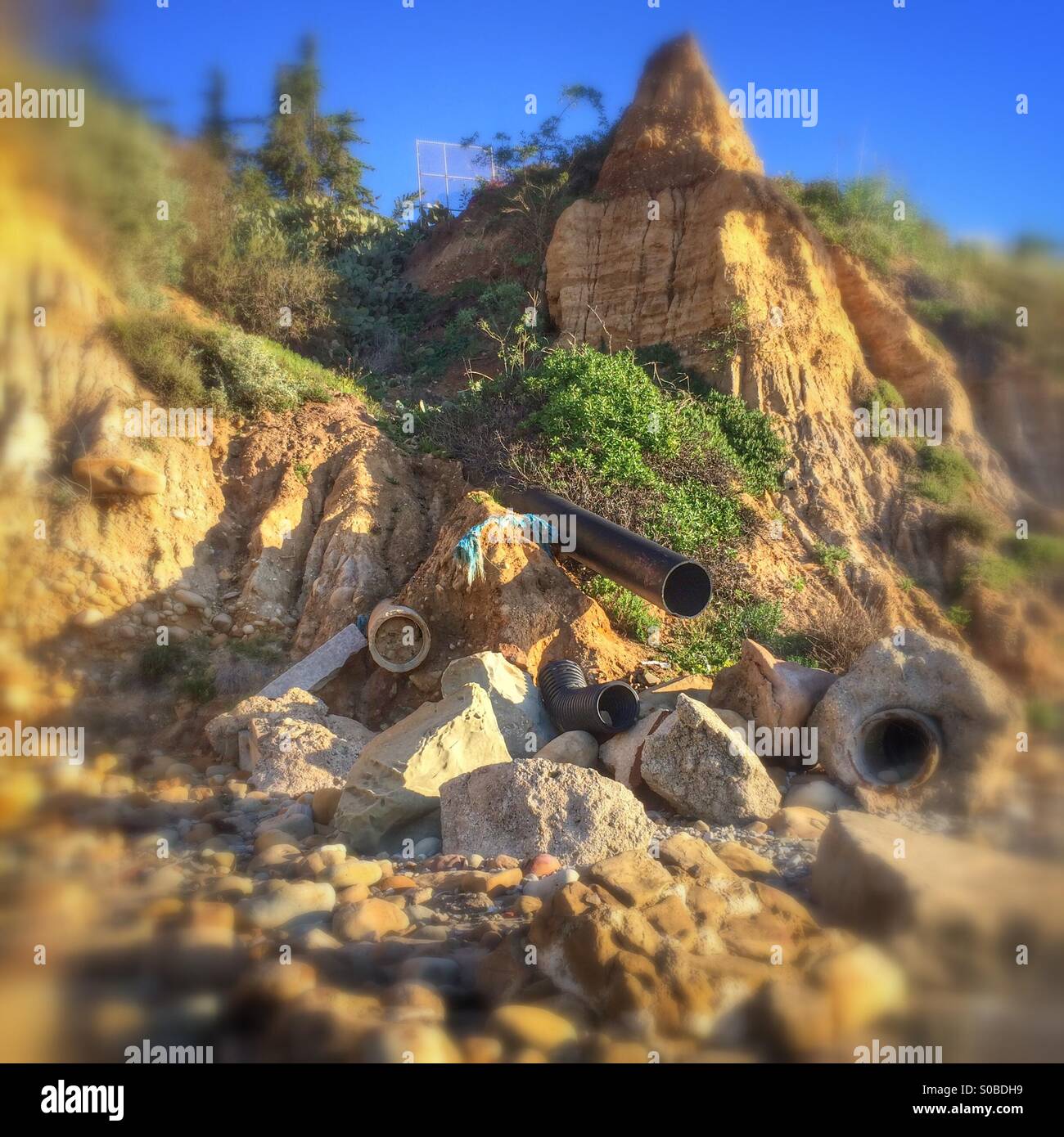 Coastal erosion causes havoc for drainage pipes Butterfly Beach Montecito, Santa Barbara County, California USA - Smartphone Captured Stock Image