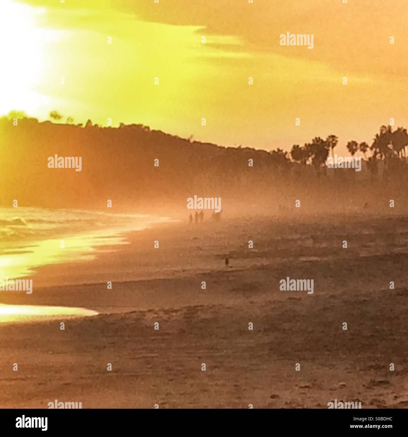 Sunset at East Beach with wind blown mist in the air, Santa Barbara, California USA Stock Photo