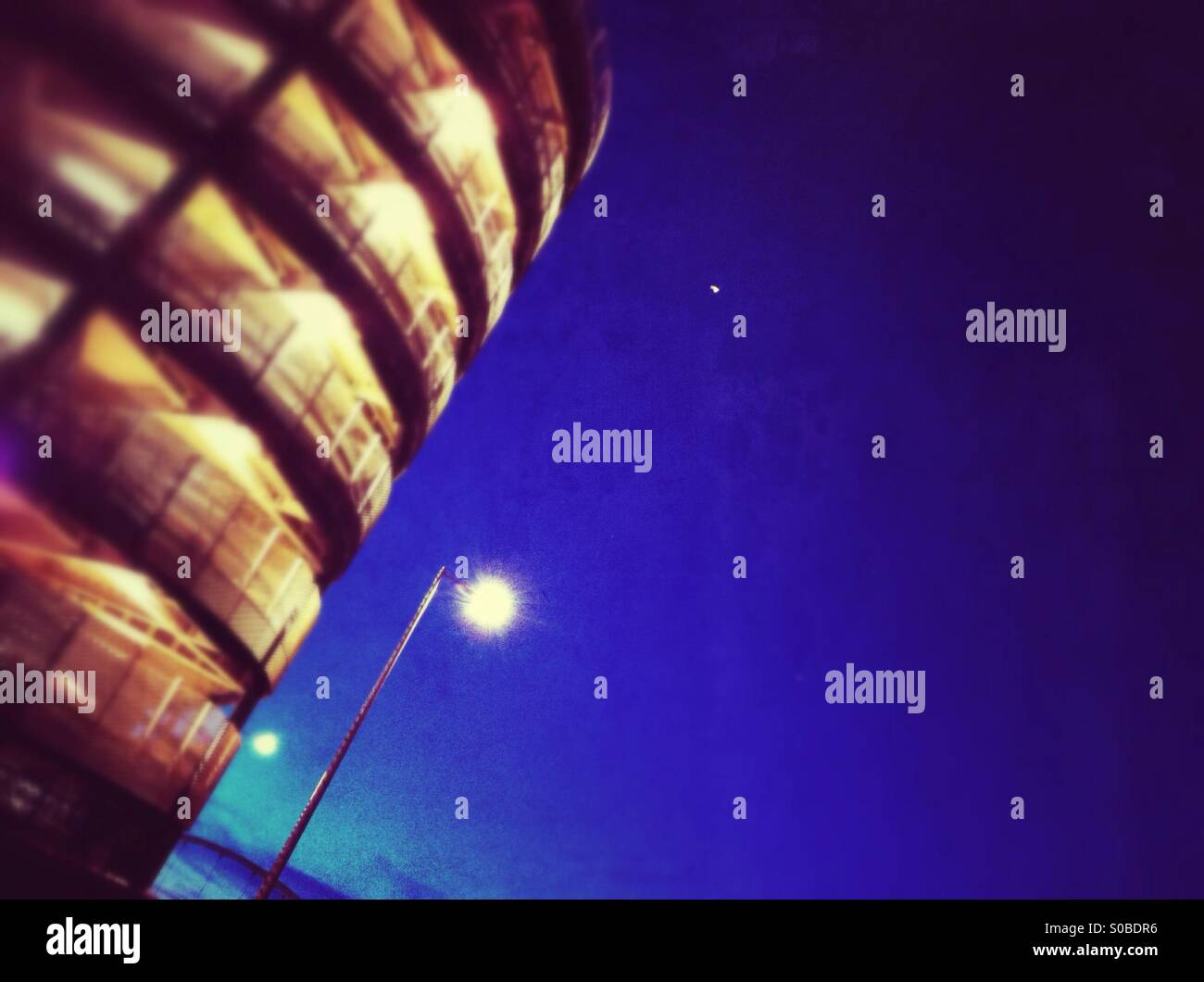 Last of the daylight behind the car parks at Stratford City shopping centre. - Smartphone Captured Stock Image