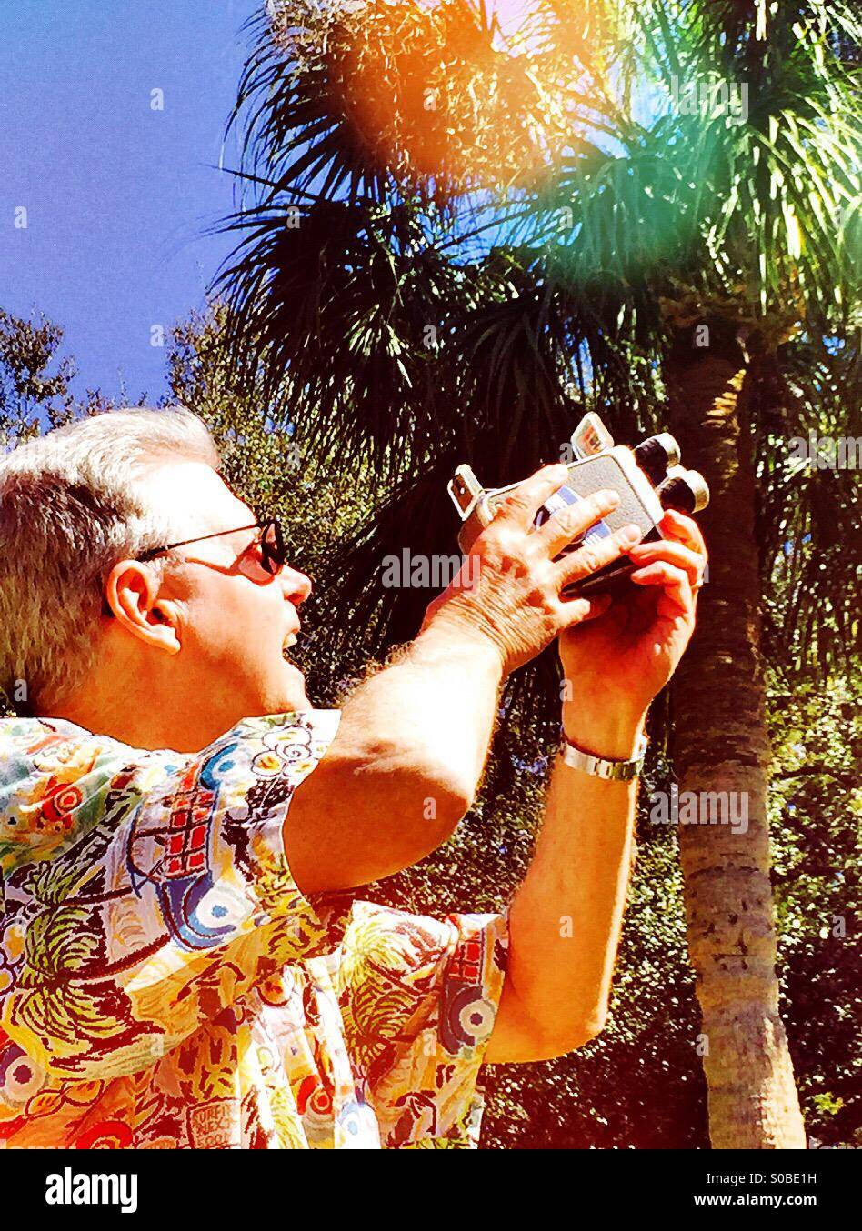 Man with vintage movie camera - Smartphone Captured Stock Image
