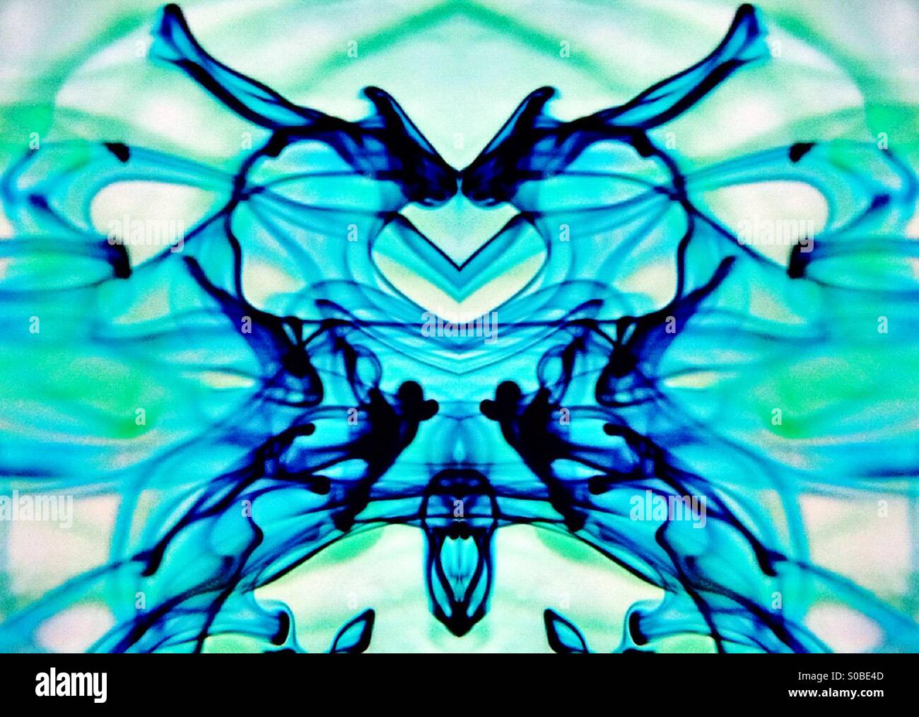 Symmetrical image of Movement of dye in water - Smartphone Captured Stock Image