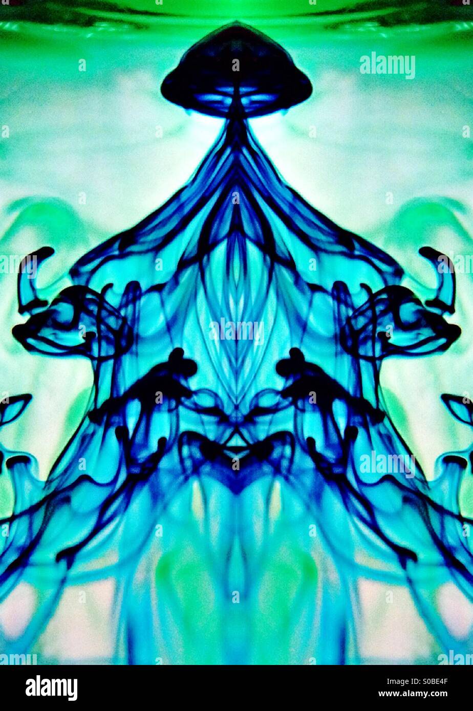 Symmetrical image of Movement of dye in water - Smartphone Captured Stock Image