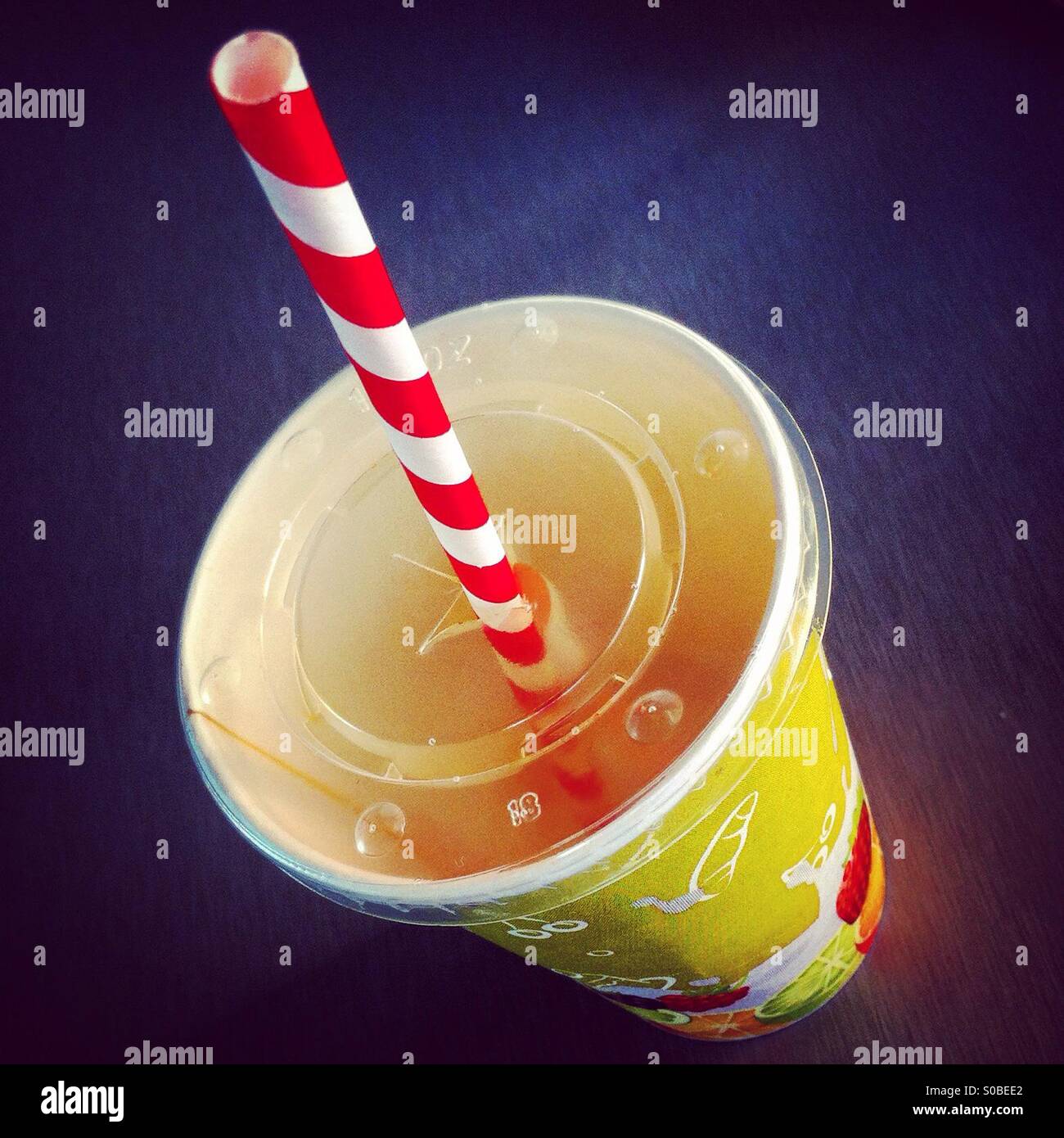 Sweet drink in paper cup with straw - Smartphone Captured Stock Image