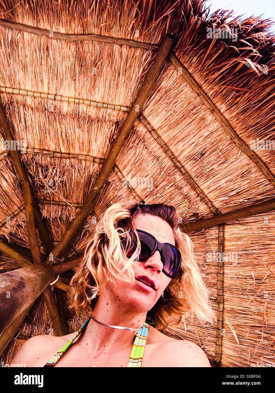Woman in cabana Stock Photo