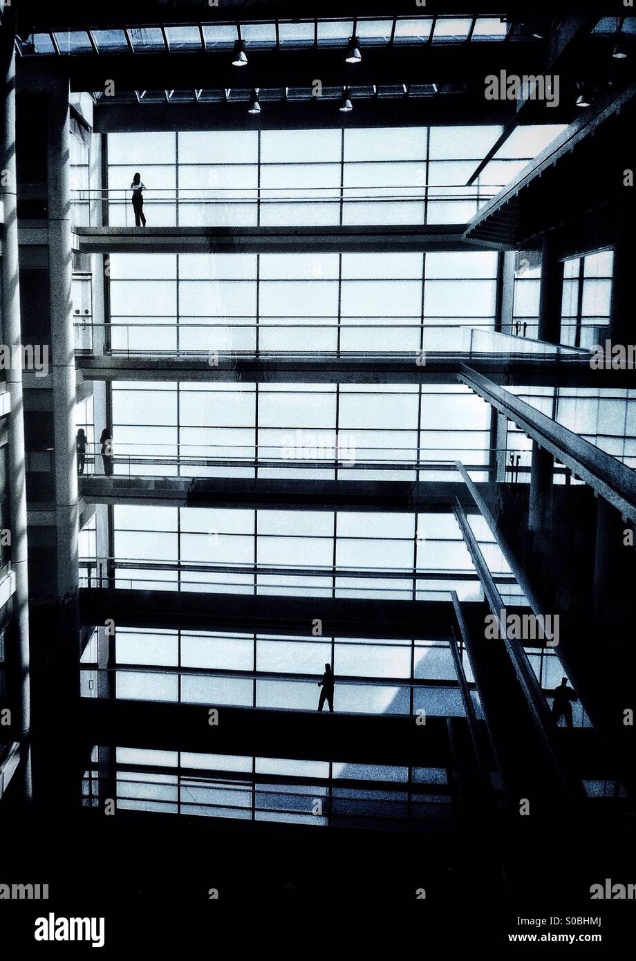 Figures in an office building Stock Photo