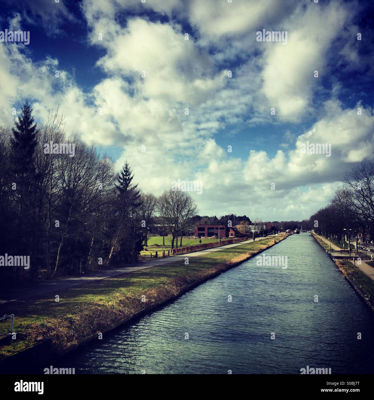 Cloudy Canal with Trees - Smartphone Captured Stock Image