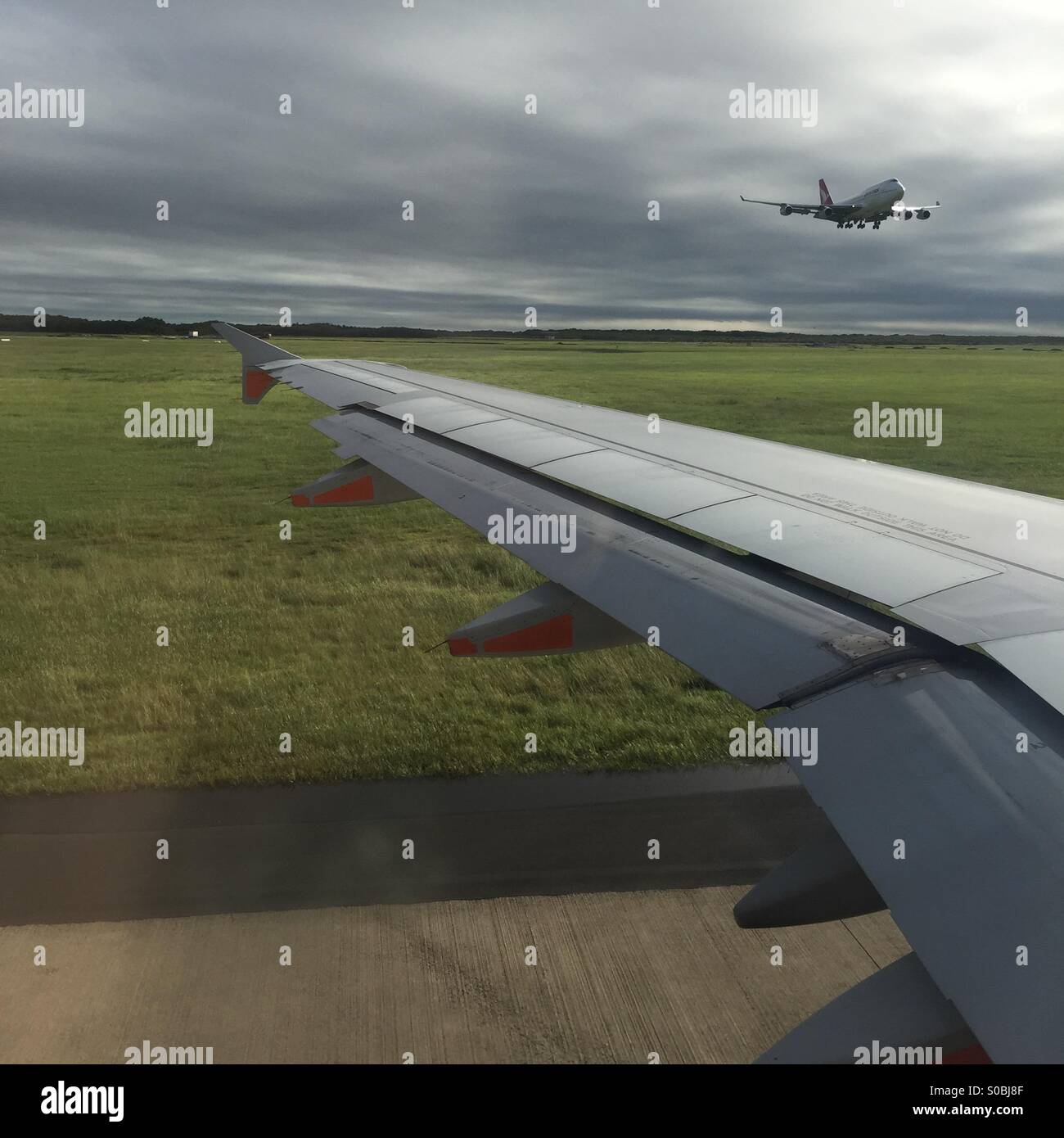 Plane landing overhead Stock Photo Alamy