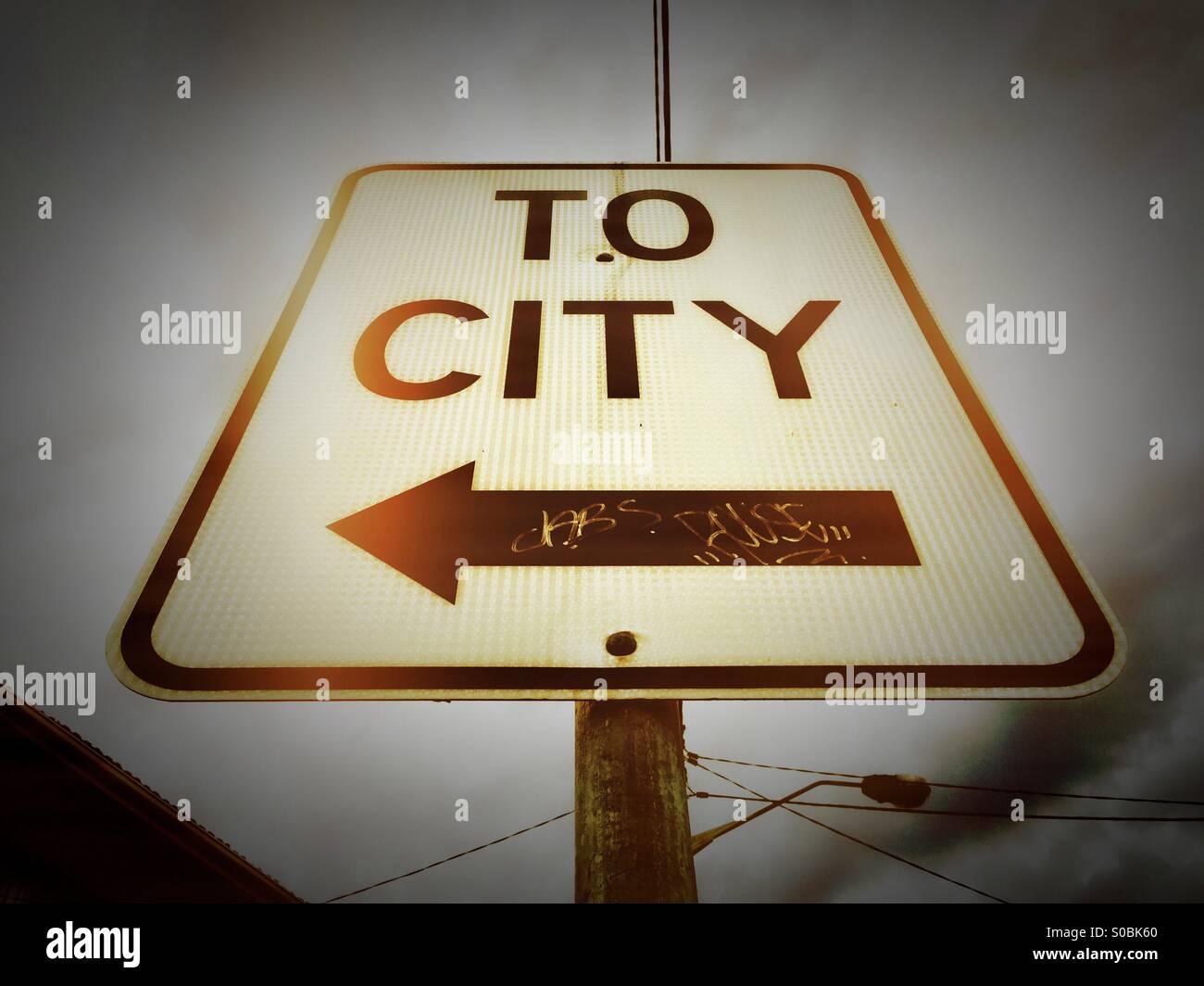 A street sign that says 'To City' - Smartphone Captured Stock Image
