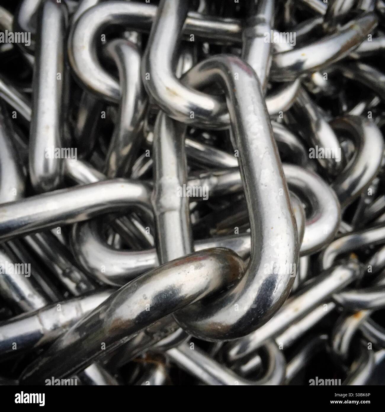 A shiny pile of metal links chain - Smartphone Captured Stock Image