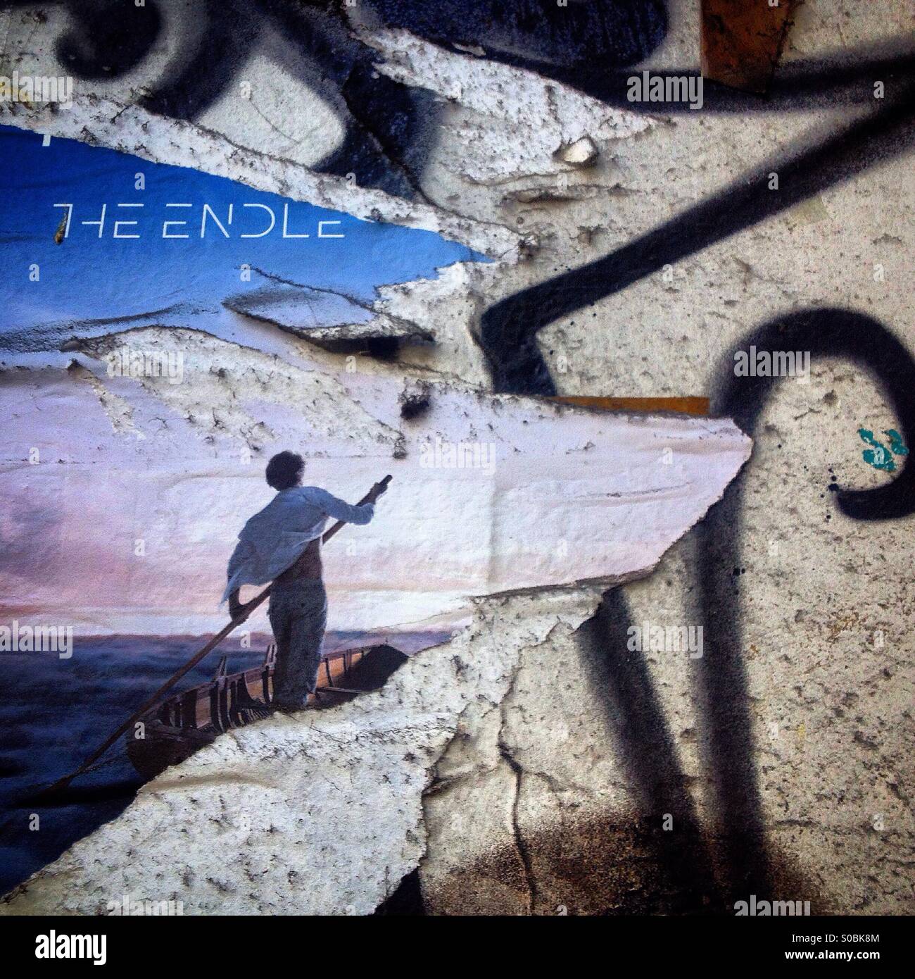 A broken advertising of a man driving a boat readin 'The endless' in a street of Colonia Roma, Mexico City, Mexico - Smartphone Captured Stock Image