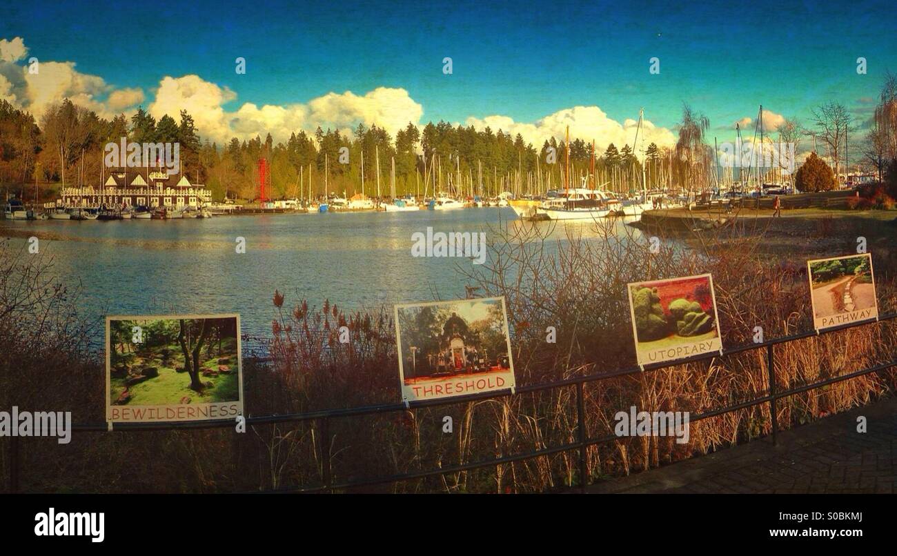 Looking across Coal Harbour, to the Vancouver Rowing Club and Stanley Park, with an artwork display in the foreground. - Smartphone Captured Stock Image