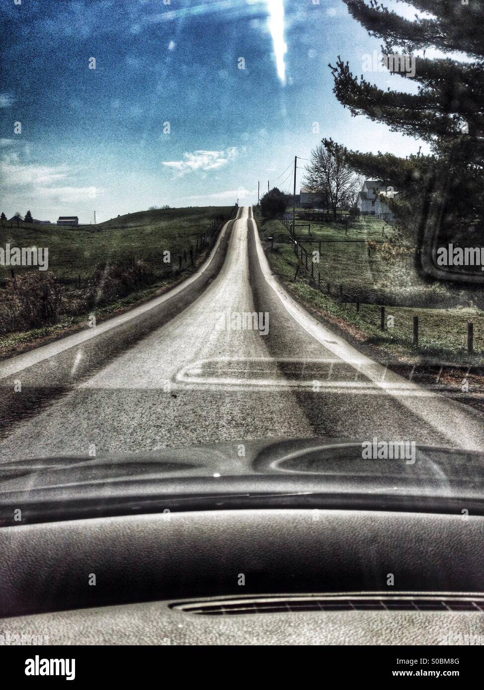 Rural road through  windshield in ohio - Smartphone Captured Stock Image