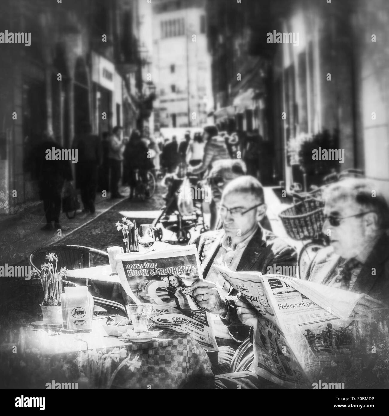 Reading the news - Smartphone Captured Stock Image