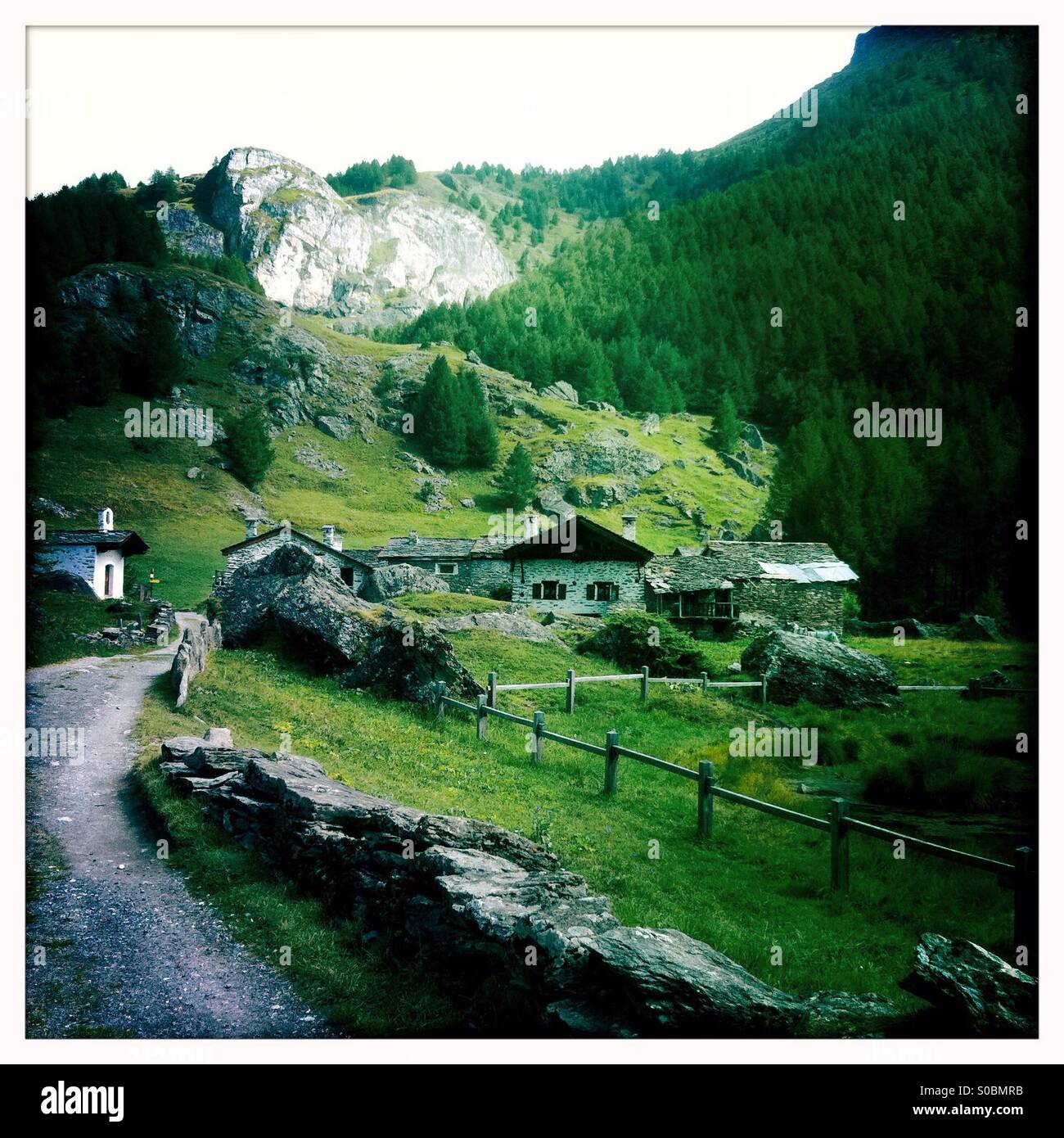 Traditional chalets in summer in the village of Le monal, near Ste foy Tarentaise, Savoie. France - Smartphone Captured Stock Image