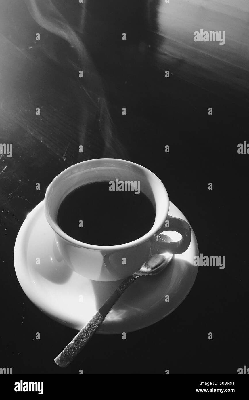 Steam rising from freshly brewed coffee. In black and white. - Smartphone Captured Stock Image