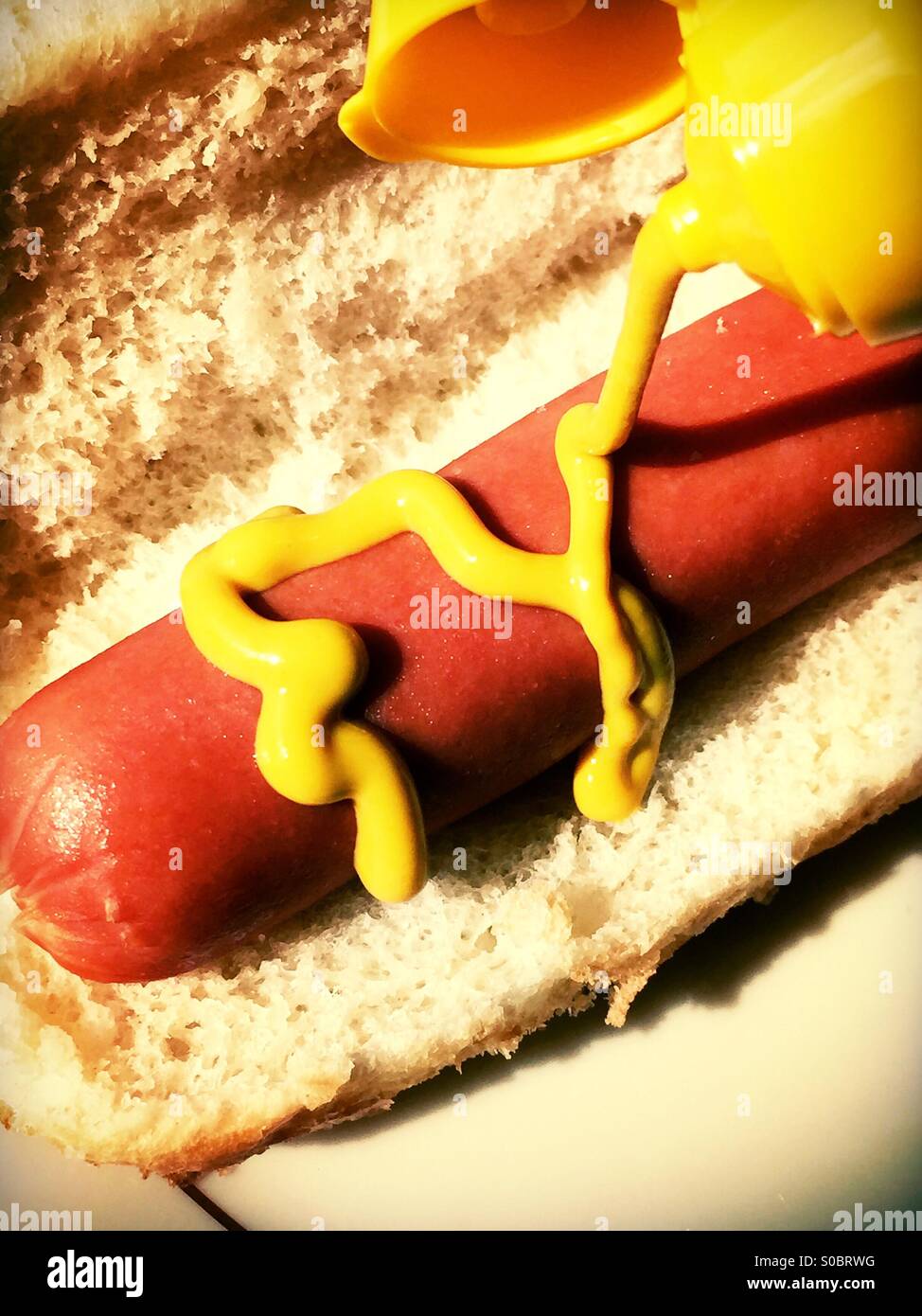 Mustard on hot dog Stock Photo Alamy