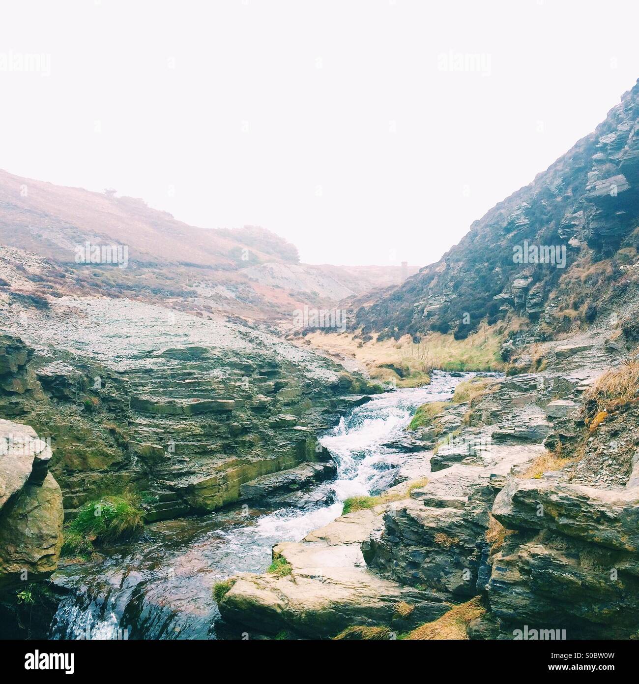 Stream flowing through rocky landscape. Stock Photo