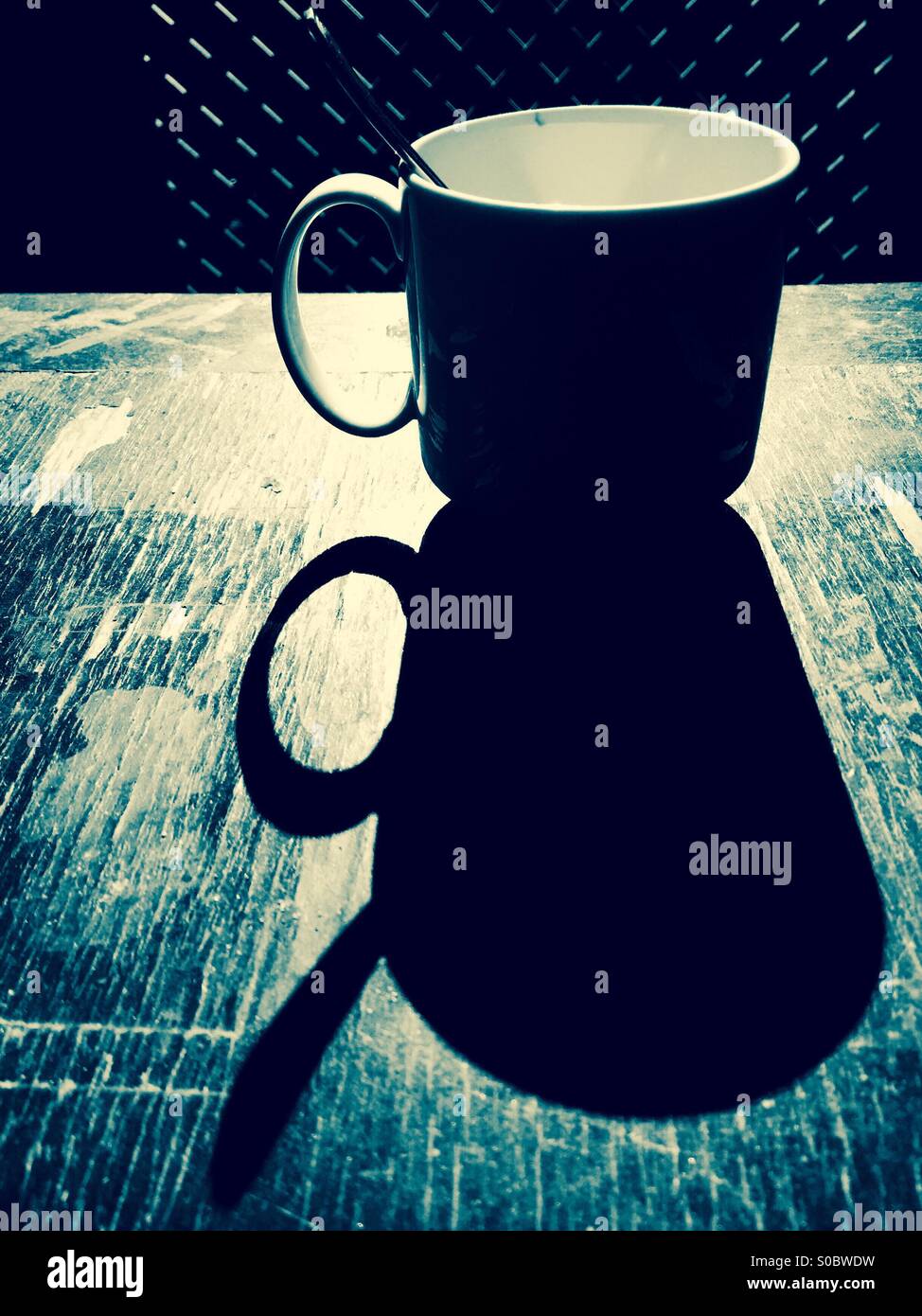 An empty cup of coffee. - Smartphone Captured Stock Image