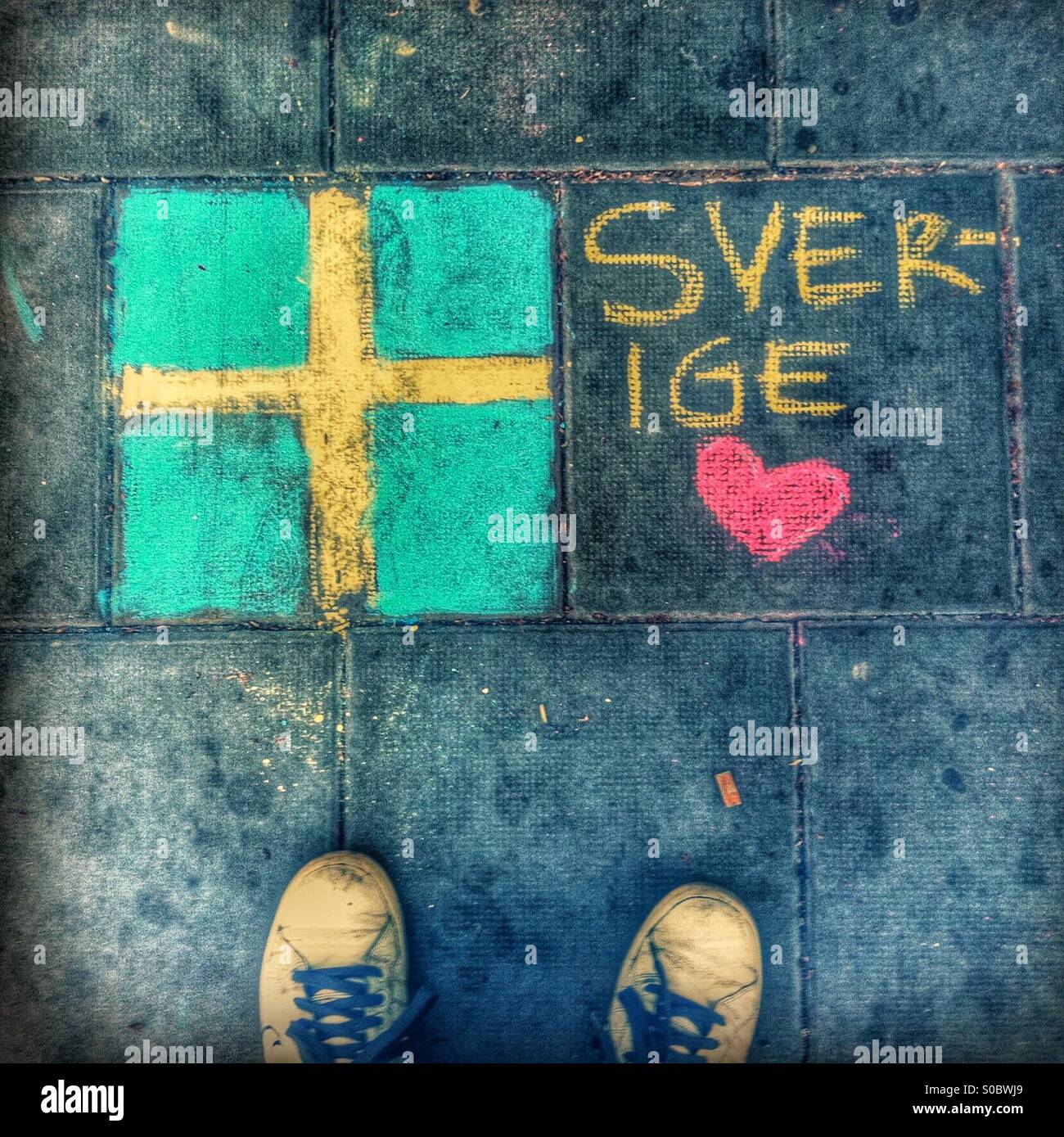 Streetpainting of the Swedish flag and heart Stock Photo