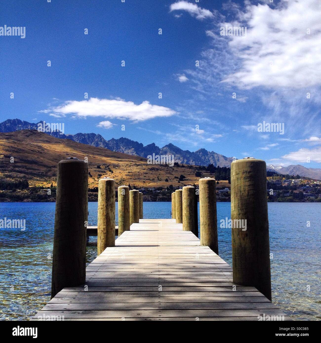 Wooden gangway over lake, New Zealand Stock Photo