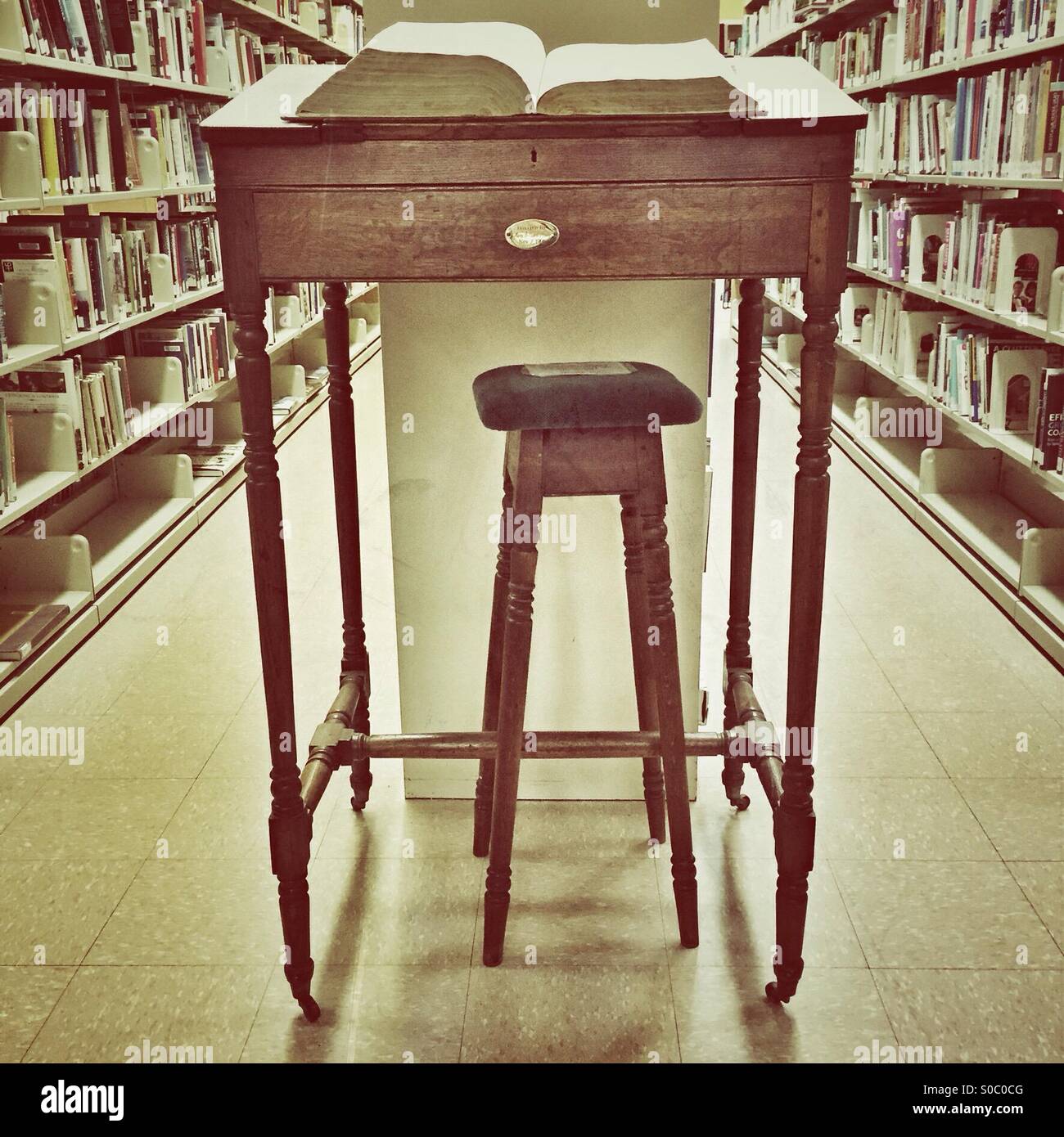 Large dictionary on its special desk in the library Stock Photo - Alamy