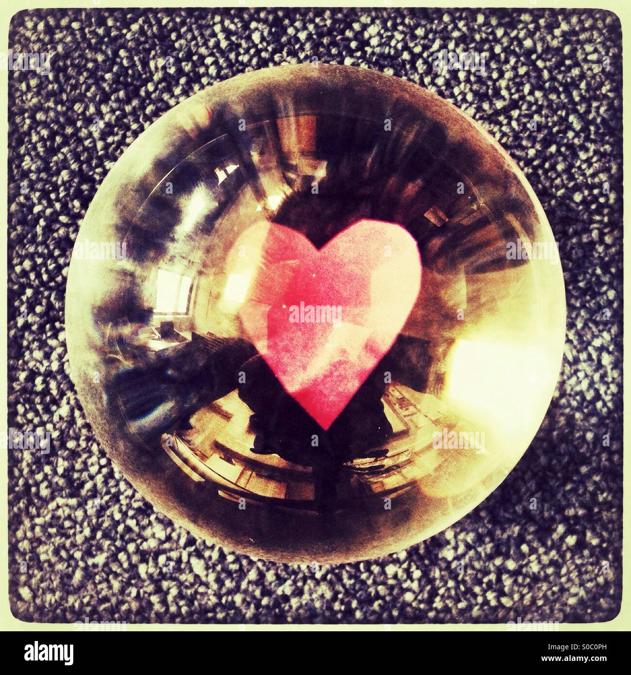 Paper heart reflected in As glass crystal ball. - Smartphone Captured Stock Image
