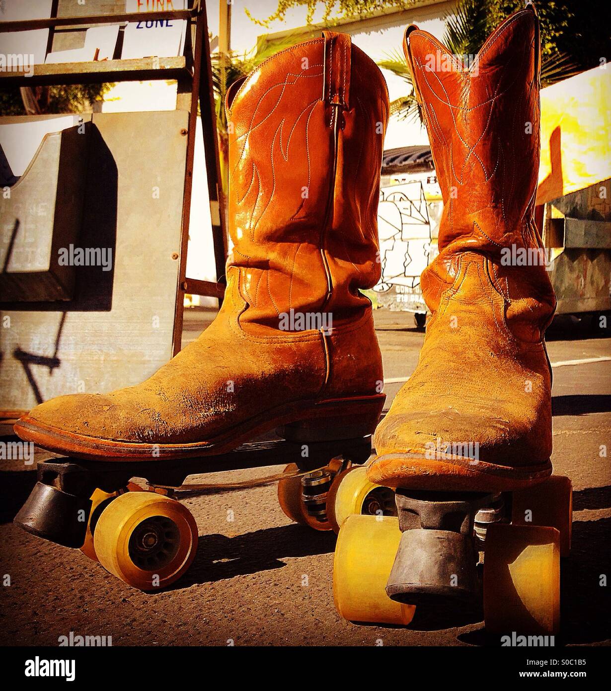 Cowboy boots with wheels, cowboy rollerskates Stock Photo - Alamy