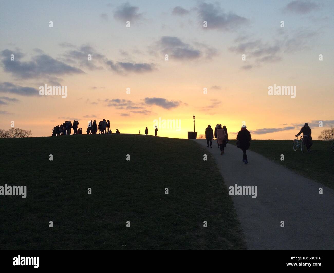 People gather at Primrose Hill in London for Sunset - Smartphone Captured Stock Image