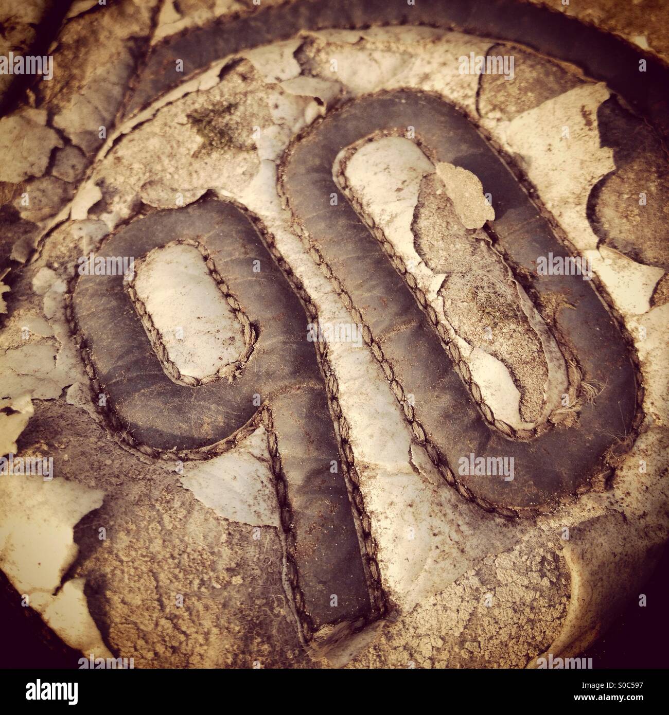 Ninety logo on a old sports shoe - Smartphone Captured Stock Image