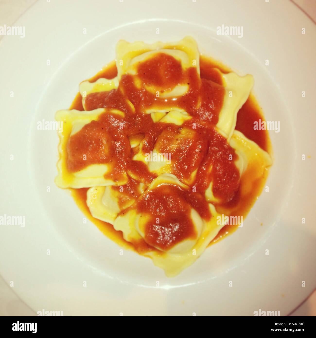 Crab ravioli and tomato sauce Stock Photo Alamy