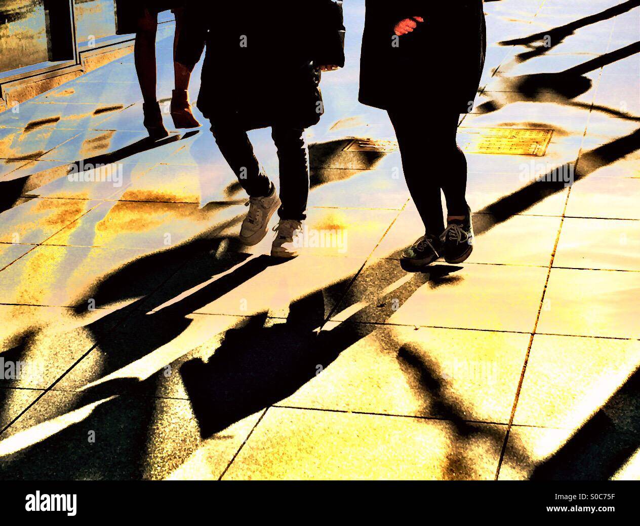 People walking on sidewalk Stock Photo - Alamy