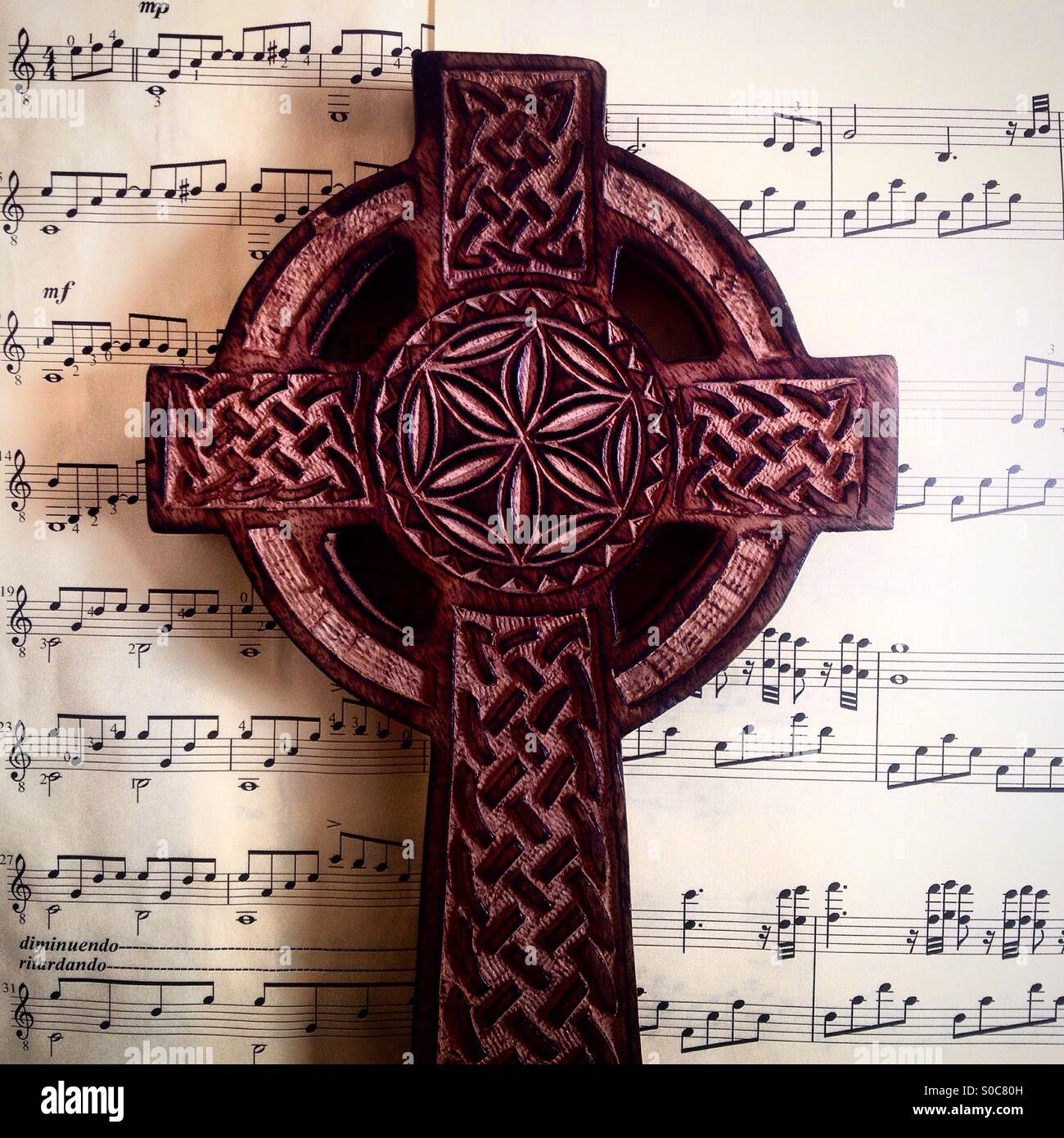 A cross inside a circle on top of musical notes in Prado del Rey, Sierra de Cadiz, Andalusia,Spain Stock Photo