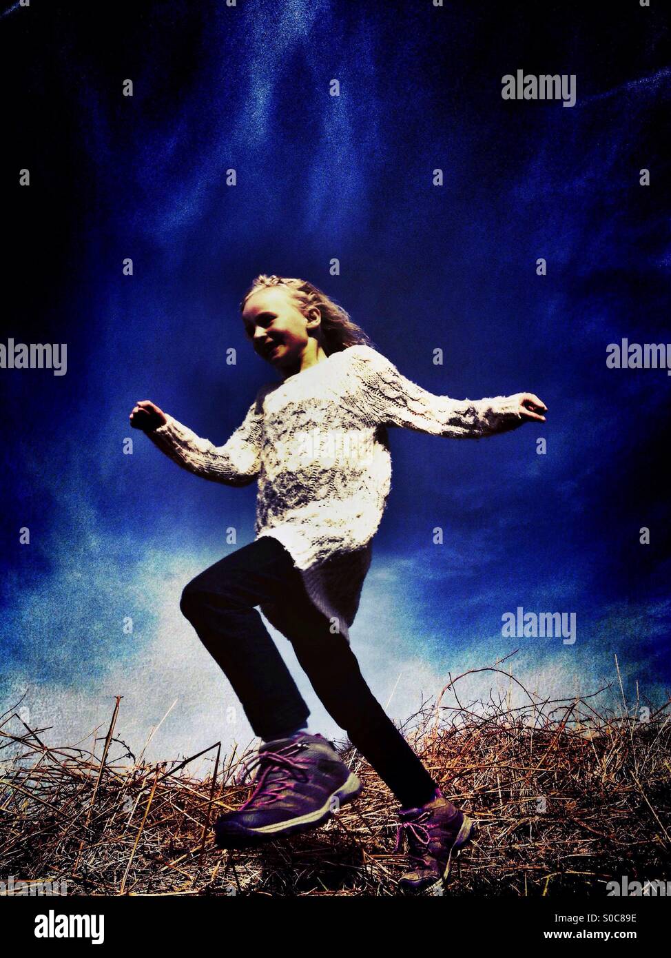 Young girl running down hill Stock Photo Alamy