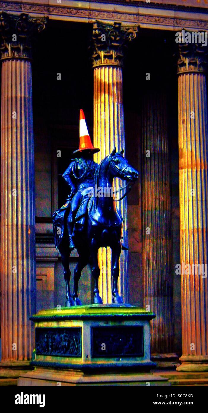 Duke of Wellington statue with a parking cone on its head, Glasgow outside the museum of modern art (GOMA) - Smartphone Captured Stock Image