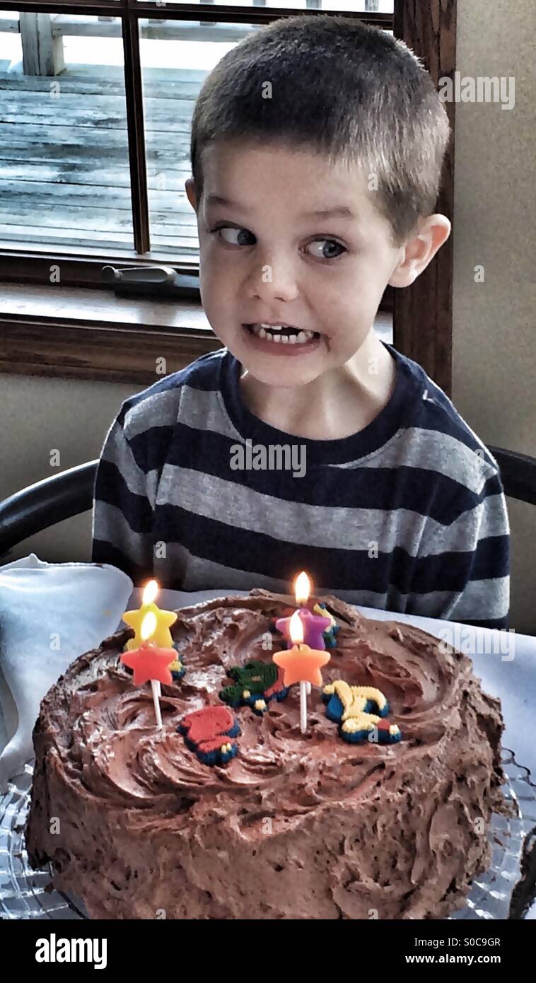 Funny birthday boy with chocolate cake Stock Photo - Alamy