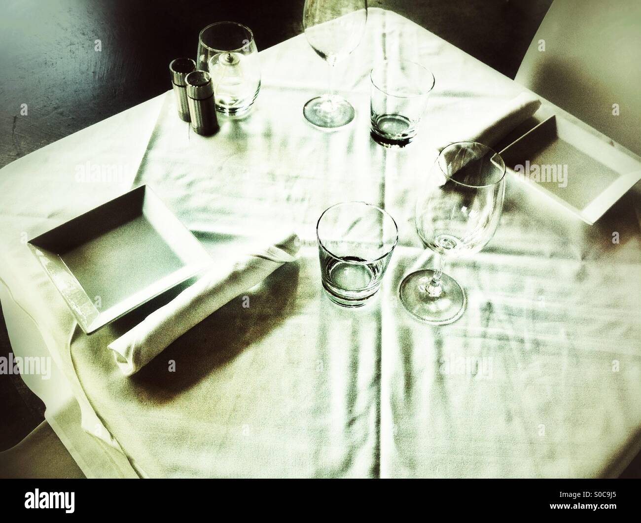 Table set for two with fresh linens - Smartphone Captured Stock Image