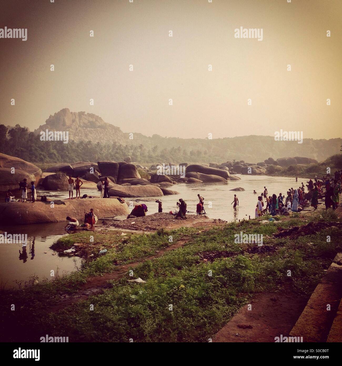 Daily river rituals - Smartphone Captured Stock Image